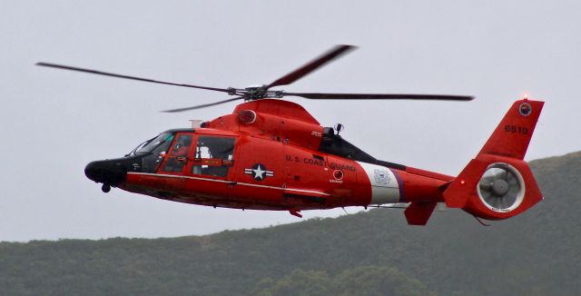 Aerospatiale Dauphin 2 (SA-365C) (N6510) - US Coast Guard HH-65 Dolphin prepares to deploy her rescue swimmer for a training exercise in Horseshoe Bay under the Golden Gate Bridge.