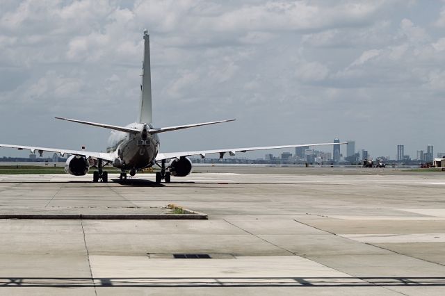 Boeing 737-700 (006) - A P-8 with the Jacksonville skyline in the background.