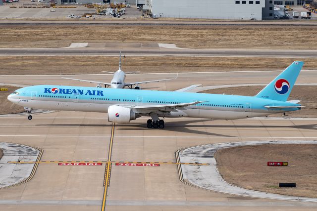 BOEING 777-300ER (HL7782) - KAL32 Heavy to Seoul departing runway 18L at Dallas/Fort Worth International Airport.