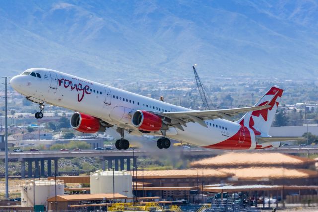 Airbus A321 (C-FJQL) - An Air Canada Rouge A321 taking off from PHX on 2/11/23 during the Super Bowl rush. Taken with a Canon R7 and Canon EF 100-400 II L lens.