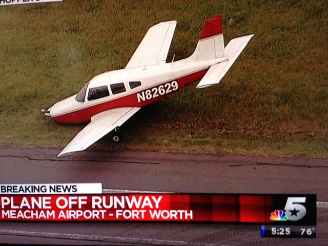 Piper Cherokee (N82629) - Nose gear collapsed on landing at Meacham Field in Ft Worth, TX 05/06/2013. The tail appears to be sitting at an angle. Perhaps a hard nose-up landing that slammed the front gear down.