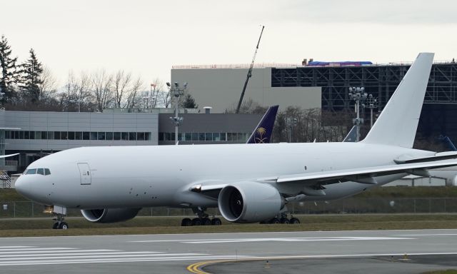 Boeing 777-200 (N5014K) - N5014K is the temporary registration of this 777F, due for a new airline, Hong Kong International Airlines. She currently wears white, but will be painted after delivery. In this shot, she is departing on a long EWA Engineering Test Flight. 