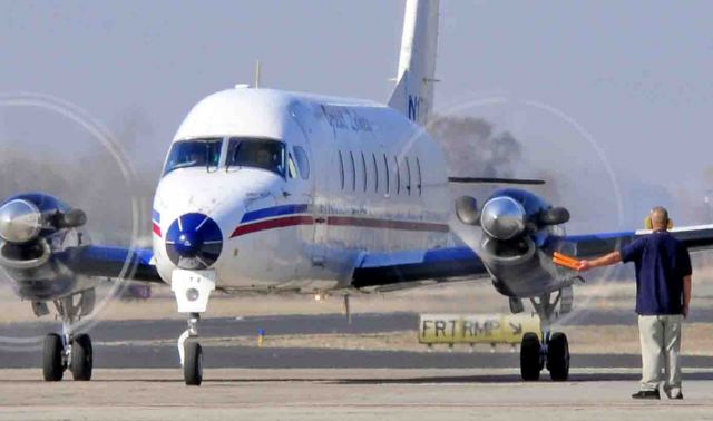 Beechcraft 1900 (N178YV) - The Mighty Beechcraft 1900 taxing from the terminal at the Merced Airport