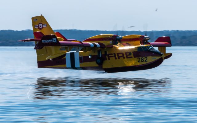 Canadair CL-415 SuperScooper (N417BT) - Bridger Aerospace's N417BT over Lake Conroe on 10 February 2022