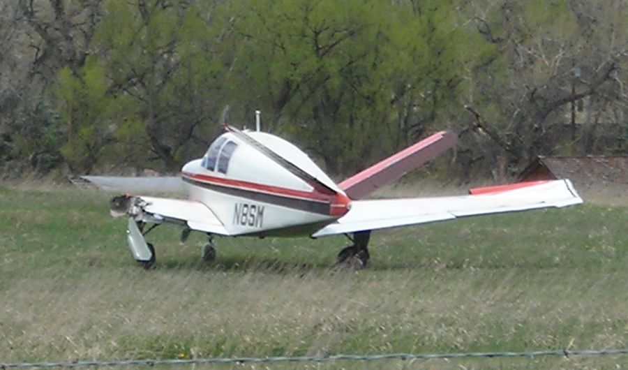 Beechcraft 35 Bonanza (N8SM) - Aircraft in the field the day following the accident.