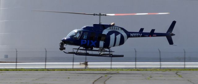 Bell JetRanger (N11TV) - LINDEN AIRPORT-LINDEN, NEW JERSEY, USA-AUGUST 21, 2020: A news helicopter from one of the local New York City T.V. stations is pictured taking off.