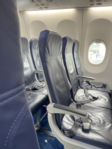 Boeing 737 MAX 8 (C-GFJM) - Every seat in this aircraft is like this one, including Premium Economy: thin 1/4" padding, no recline, short legroom. Aircraft has no power plugs, no Wi-Fi, and no entertainment system at all. 
