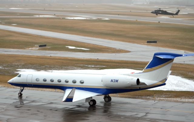 Gulfstream Aerospace Gulfstream V (N3M) - This show was taken from the old tower at the Downtown town St Paul Airport "Holman Field". The Minnesota National Guard Sikorsky UH-60 Was practicing Hovering over the runway in the fog.