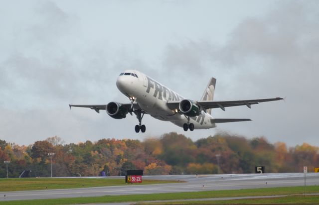 Airbus A320 (N206FR) - A awesome sight as being a Frontier Airlines Fan, seeing the plane depart with the fall colors spread across the trees in the background, Taken on the 7th of November 2017.