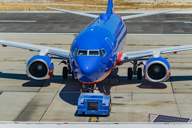 Boeing 737-700 (N7741C) - Head to head with the 737 as it gets pushed back for departure to Las Vegas