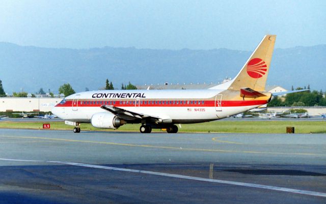 N14335 — - KSJC - one of the many things about Jet photography at SJC in the late 1970s to mid 1990s the SJ Airport Police rarely bugged me as " why are you taking photos" though I had a few encounters, most left me alone. SJCs early terminal used to be at the south end of old 30R and was commonly referred to as the old yellow Terminal. Back when I had my F-250 pick up I'd carry the ladder in the bed which allowed clear view looking north from the old Terminal Parking lot for aircraft headed on south taxiway to join 30L for departure. This photo was taken early 1990s from that location when the 06:30a-9:00an flights would push back and head towards me. I'll find some photos and post those later but the early AM sunlight was real good here. N14335 was LN 1298 and delv in Nov 1986. Now scrapped from after being stored in 2009.