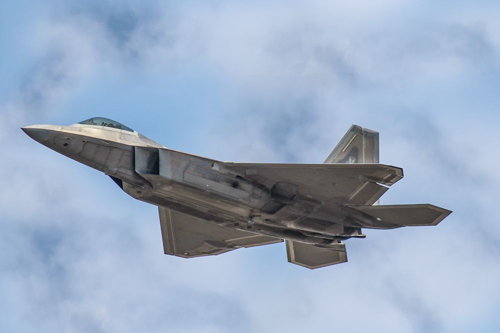 Lockheed F-22 Raptor — - Using my Canon 600mm lens I got this clear tight shot of an F22 doing a high speed pass over the crowd at the Gulf Coast Salute at Tyndall Air Force base in Florida. The camera settings were Shutter 1/3200 F5.6 ISO 400. Votes and positive comments are always appreciated. Questions about this photo can be sent to Info@FlewShots.com