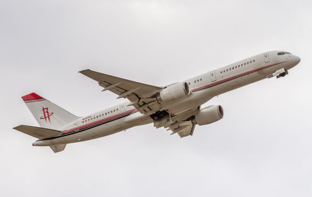 Boeing 757-200 (N757SS) - Paradigm Air Operators. Weve seen this aircraft in several different schemes. Here shes dressed in the NBAs Houston Rockets attire after a close game at the Air Canada Center in Toronto against the Raptors. (The Raptors squeaked out a 108-105 victory.) Here she is seen climbing out of YYZ from runway 06L and heading to Dallas