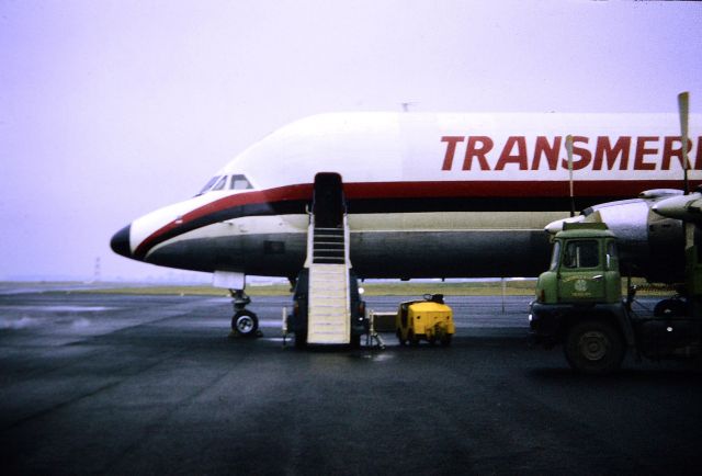 Canadair CL-44 Forty Four (N447T) - Trans Meridian Air Cargo - CL-44 (reg N447T - to the best of my knowedge) (aka TMA). Front end "shot". Not sure of the airline code I have used on the profile is of the "original" TMA is correct on this particular, (then), "old" airline but either way (for myself) an old beautiful cargo a/c... Photo at NCL circa 1973-74. Great aircraft.... They don't make "classics" like them nowadays...