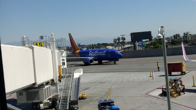 Boeing 737-700 (N565WN) - Pulling into Terminal 1 Gate 15 at LAX, arriving from KMSY, New Orleans