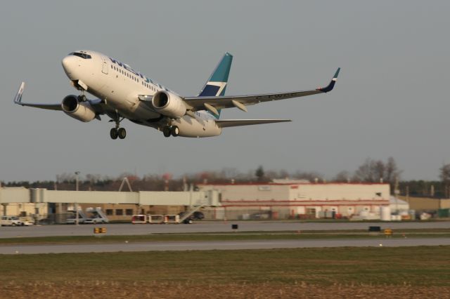 Boeing 737-700 (C-FWCC) - April 17, 2006 - departed from London Airport