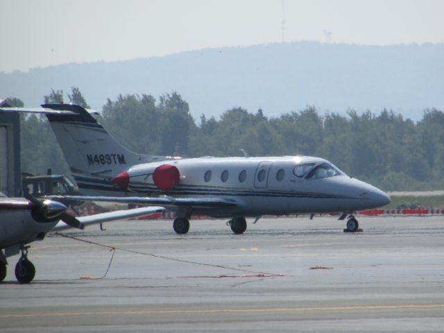 Beechcraft Beechjet (N489TM) - Basking in the sultry Bangor sun.