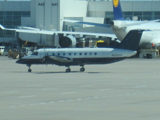 Embraer EMB-120 Brasilia (N293UX) - With DLH A340-600 in background.