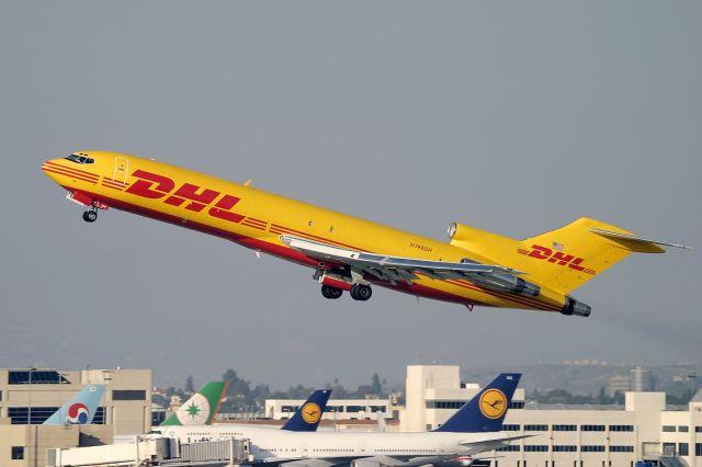 Boeing 727-100 (N746DH) - A DHL Boeing 727 taking off @ LAX. Classic three holer!