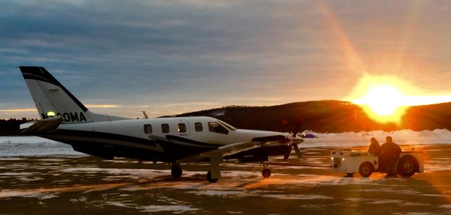 Socata TBM-850 (N580MA) - John Chmiel and his son, Wyatt Chmiel of the Wausau Flying Service putting the TBM-850 (Piloted by Jordan Brost) back into the hangar for the night.