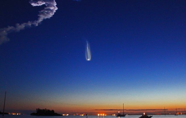 — — - Space Shuttle Discovery climbing into the Florida dawn like a slow moving comet in the sky, passing through 7,000mph, in route to the International Space Station.