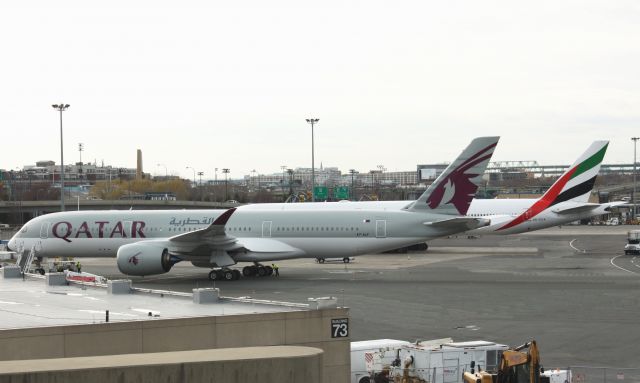 Airbus A350-900 (A7-ALF) - Inaugural day for Qatar service to Boston Logan parked next to other Middle Eastern carrier Emirates B777-300. This would also mark the first visit by an A350 to Boston Logan as well.