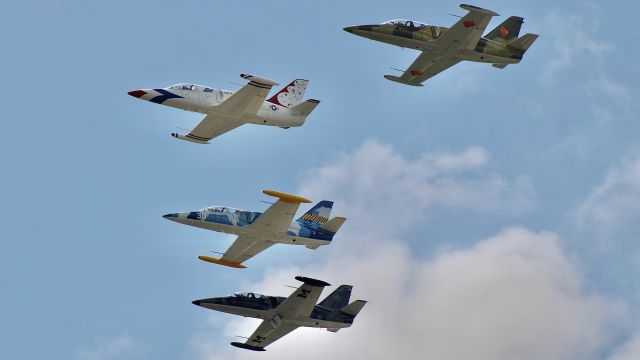 Aero L-39 Albatros (N178CW) - Four-ship of L-39’s flying formation over the flight line at Oshkosh 2023. br /br /7/28/23