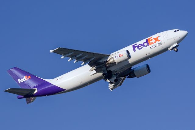 Airbus A300F4-600 (N674FE) - 01/17/2015. Early morning takeoff On the way to KMEM. The longer RWY 1L was closed for a while so this was from the shorter 1R RWY using a pretty high angle of attack.