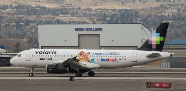 Airbus A320 (XA-VOM) - A gray, overcast day last month (Dec 22) got a bit more colorful about ten minutes before straight-up noon when VOIs XA-VOM special livery A320 "Michael" arrived in Reno from Don Miguel Hidalgo y Costilla International (MMGL) in Guadalajara. In this click, it is reversing thrust to slow down as it rolls out just after landing on 16R.