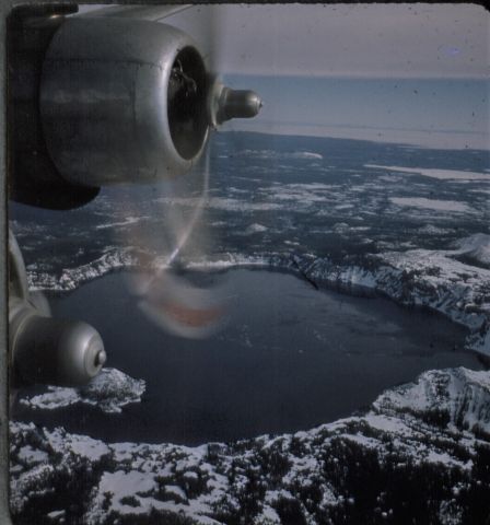 Douglas DC-6 — - 1955 over crater lake