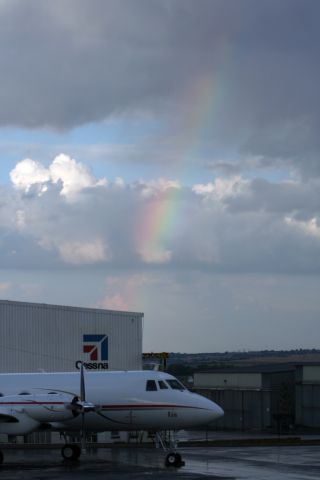 Grumman Gulfstream 1 — - G1 with a nice rainbow in the background in South Africa.