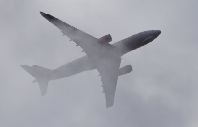 Airbus A330-200 (N334QT) - Avianca Cargo´s A330-200 passing through a cloud almost on its final approach to SUMU, runway 06