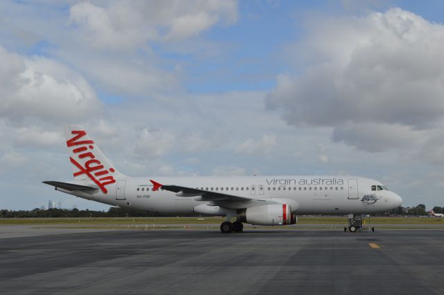 Airbus A320 (VH-FNP) - Taken on the tarmac at Perth Airport with the city skyline in the background