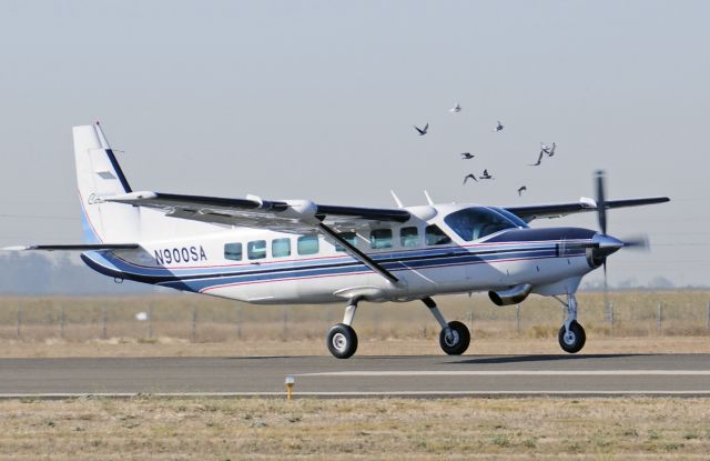 Cessna Caravan (N900SA) - Cessna Caravan (N900SA) departs runway three-zero at Merced Regional Airport (KMCE) headed to Honolulu (PHNL)