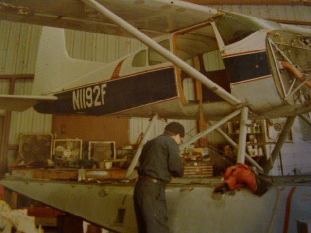 Cessna Skywagon (N1192F) - Mr. Jose Delgado working on 185 amphib at Westwego Airport.