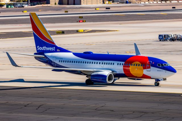 Boeing 737-700 (N230WN) - A Southwest 737-700 in Colorado One special livery taxiing at PHX on 2/10/23 during the Super Bowl rush. Taken with a Canon R7 and Canon EF 100-400 II L lens.