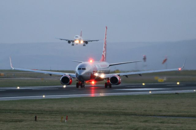 Boeing 737-800 (G-JZHG) - LS935 departing to Turin as SWR390 - HB-IJQ -  arrives from ZRH in the background