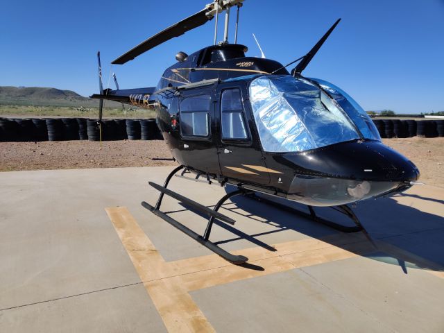 Bell JetRanger (N42JB) - JB's Bell 206 on the ground at Inde Motorsports Ranch.  Homebase: KTUS.