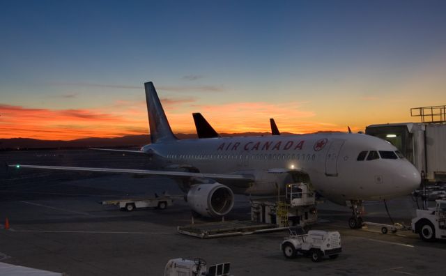 Airbus A320 (C-FDQV) - Sunrise at San Francisco airport, waiting to board. 