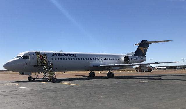 Fokker 100 (VH-UQC) - Firefighters board VH-UQC at Longreach Airport on the 16th July 2018. This aircraft was headed for Mount Isa from Brisbane but made an emergency landing at Longreach YLRE.