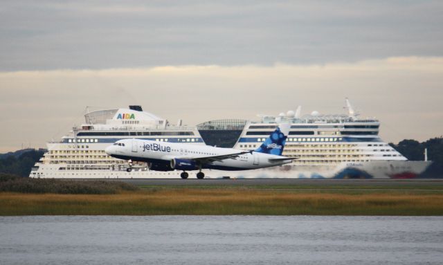 Airbus A320 (N568JB) - Aircraft departure while a cruiseship arrives