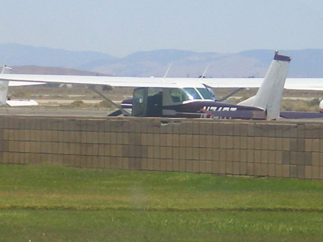 Cessna 152 (N74GT) - The152 is parked and the pre flight inspection is being  preformed.