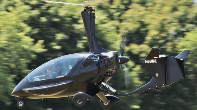 ELA AVIACION ELA-10 Eclipse (N561HL) - A sharp looking blacked out gyrocopter running the gauntlet on the light-sport grass field at KOSHbr /br /7/28/23