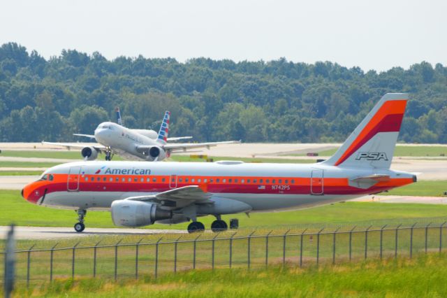 Airbus A319 (N742PS) - Awaiting clearance to taxi across Runway 36C to the terminals.   