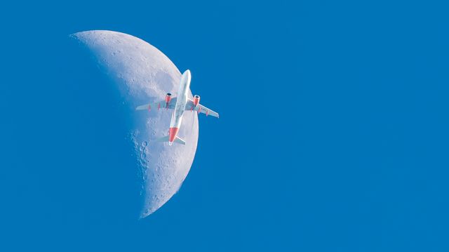Airbus A320 (G-EZTI) - Easyjet A320 passes the moon. taken from my backyard! took me 4 years to get a shot like this! 