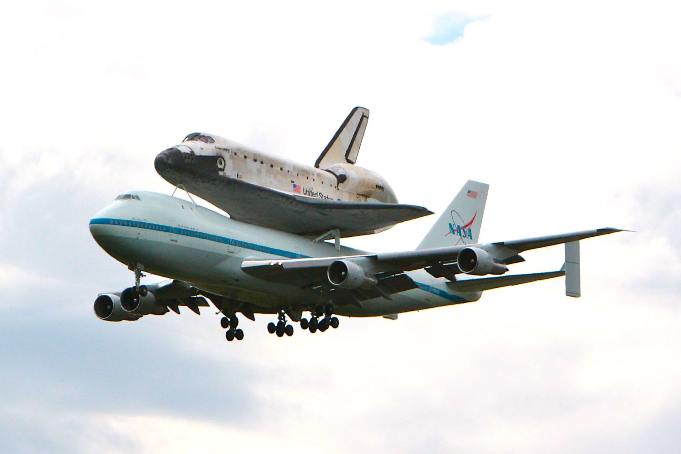 BOEING 747-100 (N905NA) - The last flight of the Space Shuttle Discovery riding on the back of this 747 seen here passing the Udvar Hazy Air & Space Museum at Dulles International Airport in Chantilly, VA.