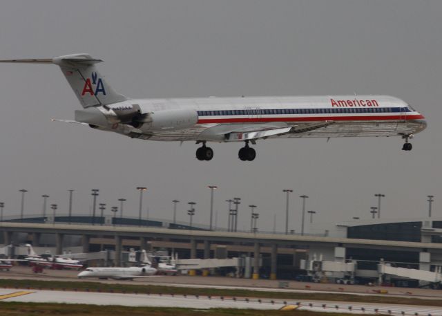 McDonnell Douglas MD-80 — - MD80 over the threshold, you can see the runway markings reflecting off the fuselage