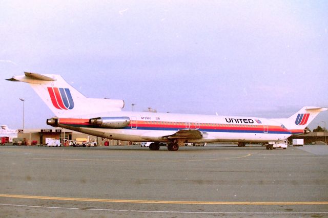 BOEING 727-200 (N7295U) - KSJC - It must be Sunday because I've parked in the old rental car carwash/prep area and usually no one was here real early and I wouldn't get told to leave....The Chicago flight is on pushback sans wing-walkers and the tug driver will soon position this jet 180 degrees right in front of me, then tug this 727-200 nose 1st out to the ramp before start up. The small one story terminal expansion shown here was done late 1960s as more terminal gates were needed for growing San Jose Airport - not yet an International airport. Above the reg number here, peeking out above the jet is the then new 1960s era Control Tower view looking north. Since dad was a traveling sales manager he used United Airlines weekly( flew out Sunday nights and home Friday nights) we were at SJC every week growing up. Before this terminal expansion here with the C gates, the old observation deck was facing this jet, and a very small platform, luckily later SJC Officials moved the observation deck to the west side of the C gates facing the ramp and runways with a bit larger platform..though the view was limited to looking west and south only. Apprx photo date here early 1990s.