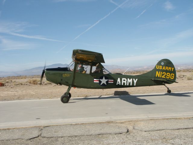 N129G — - This was one of the first photos i took back in 2002 with my (then) shiny new DiMAGE 7i. This is at an old Goodyear test track, now a popular R/C Airplane site called The B Slab" in the Antelope Valley in California, and what is left is nothing more than a concrete strip about 150 feet long. A beautiful, and well maintained little aircraft.