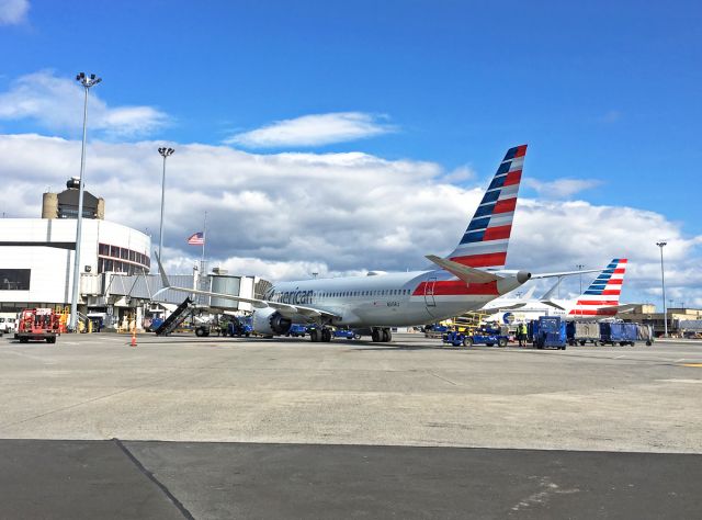 Boeing 737 MAX 8 (N315RJ) - AA gate B32 half mast flag for Senator John McCain. Also departure gate for AA11 on 09/11/01. Never Forget 